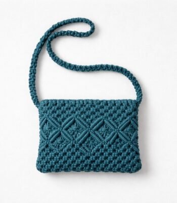 Handmade teal geometric macramé crossbody bag with diamond knot pattern and long strap