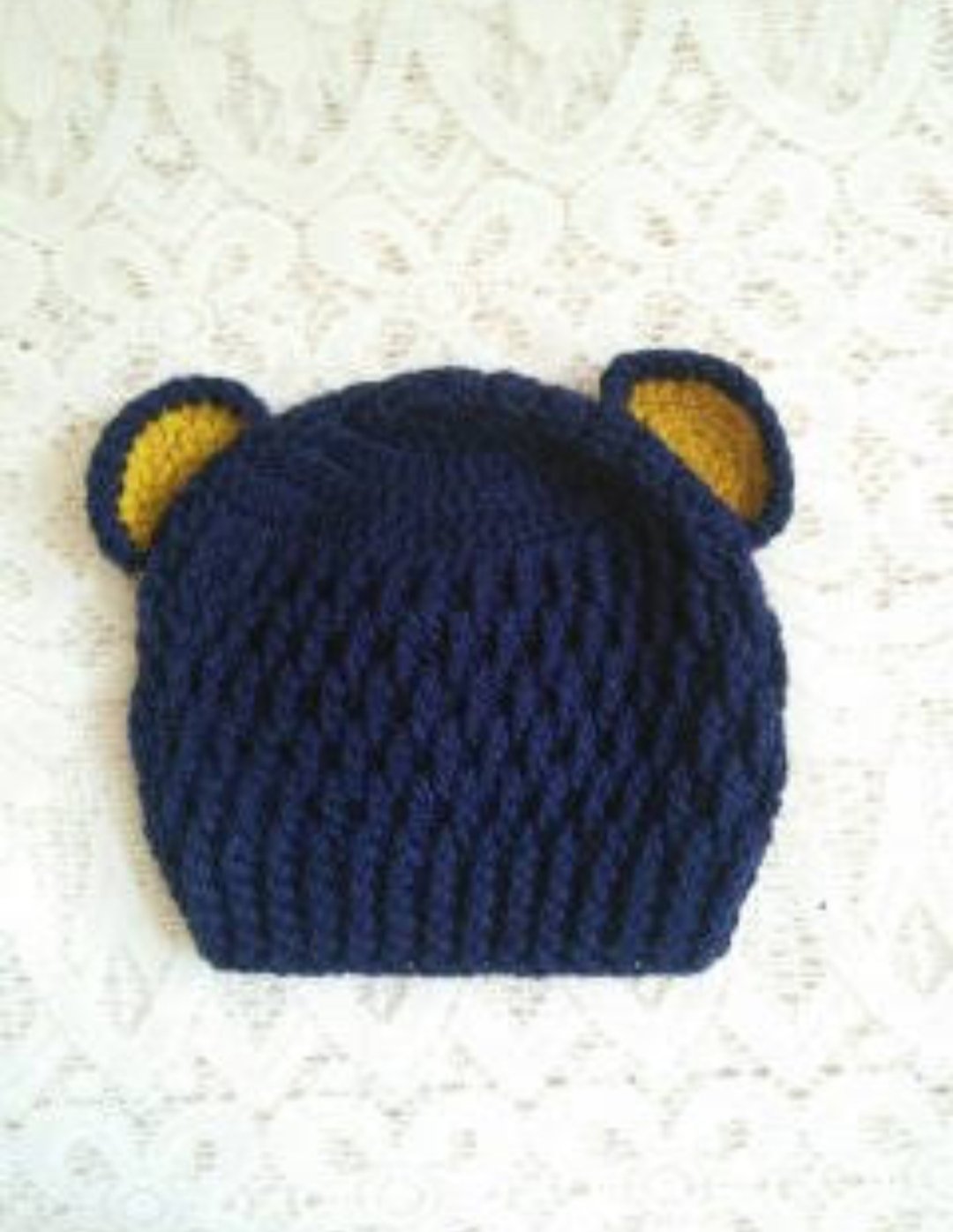 WhatsApp Image 2026-06-02 at 10.46.37 AM (1) Handmade navy blue crochet baby bear ear cap with yellow inner ear detailing