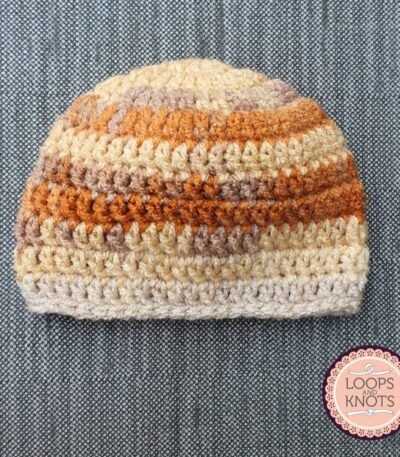 Handmade multicolour crochet baby beanie cap with cream beige and brown striped winter design