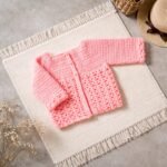 Coral Pink Crochet Baby Cardigan with Openwork Design